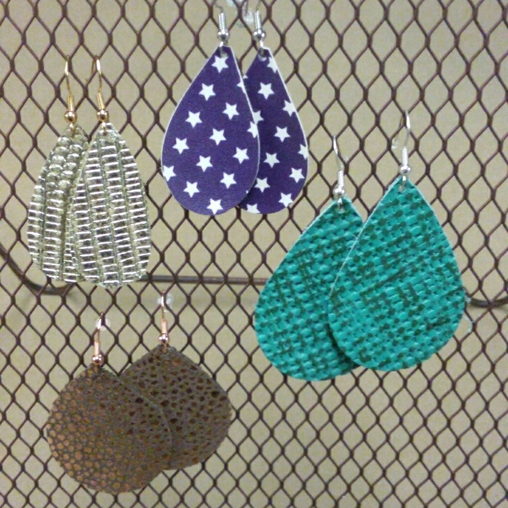Set of four handcrafted leather earrings.